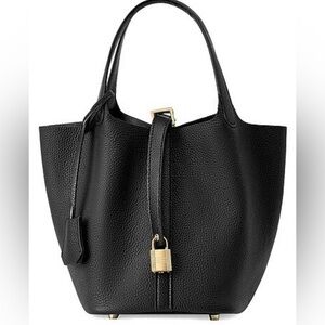 Small leather black tote with gold hardware detailing!